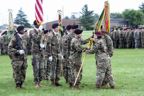 Col. Eugenia Guilmartin, commander of the 16th Military Police Brigade, hands Lt. Col. S. Joel Schuldt, commander of the 716th MP Battalion assigned to the 16th MP Bde. and attached to the 101st Airborne Division (Air Assault) Sustainment Brigade, 101st Abn. Div., the battalion colors during the change of command ceremony, June 15, 2017, at the division parade field on Fort Campbell, Kentucky. (Sgt. Neysa Canfield/101st SBDE Public Affairs) 