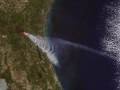 Brown carbon particles produced by wildfires such as the ones that have scorched parts of Georgia and Florida this year are more likely than previously thought to travel to the upper levels of the atmosphere and impact climate. (NASA image courtesy Jeff Schmaltz LANCE/EOSDIS MODIS Rapid Response Team, GSFC)