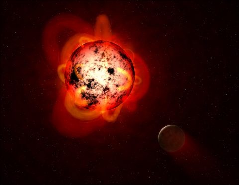 This illustration shows a red dwarf star orbited by a hypothetical exoplanet. (NASA/ESA/G. Bacon (STScI))