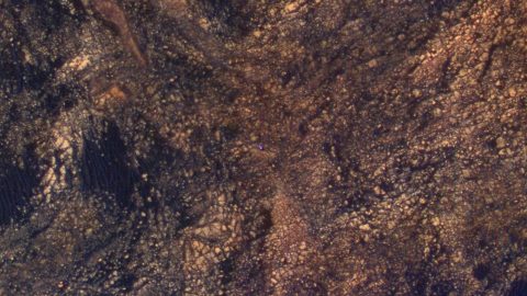 The feature that appears bright blue at the center of this scene is NASA's Curiosity Mars rover amid tan rocks and dark sand on Mount Sharp, as viewed by the HiRISE camera on NASA's Mars Reconnaissance Orbiter on June 5, 2017. (NASA/JPL-Caltech/Univ. of Arizona) The feature that appears bright blue at the center of this scene is NASA's Curiosity Mars rover amid tan rocks and dark sand on Mount Sharp, as viewed by the HiRISE camera on NASA's Mars Reconnaissance Orbiter on June 5, 2017. (NASA/JPL-Caltech/Univ. of Arizona)