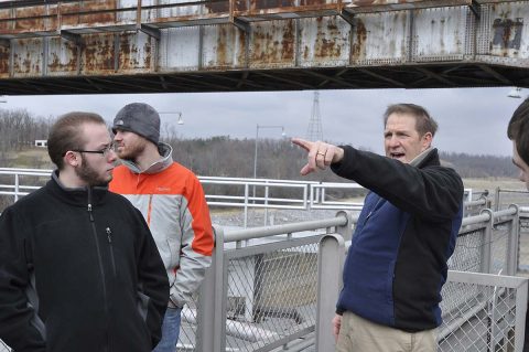 U.S. Army Corps of Engineer, Nashville District employee Michael Looney, Natural Resource Program Manager at the Lake Barkley Resource Center talks with students and faculty from University of Tennessee at Martin Hydrology and Hydraulics class about lock operations during a tour of the Lake Barkley Barkley lock and dam. (Mark Rankin, USACE) 