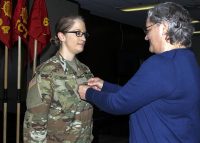 First Lt. Sarah Mehr, a transportation officer with 632nd Movement Control Team, 129th Combat Sustainment Support Battalion, 101st Airborne Division (Air Assault) Sustainment Brigade, 101st Abn. Div., is promoted to the rank of captain by her mother, May 5, 2017, during a promotion ceremony at the 129th CSSB headquarters building on Fort Campbell, Ky. (Sgt. Neysa Canfield/ 101st SBDE Public Affairs Office)