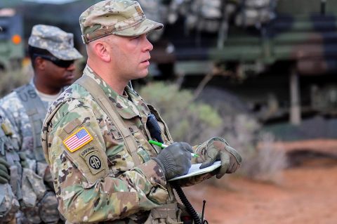 Maj. Josh Howard, senior fires observer controller with Training and Evaluation Division, Joint Modernization Command takes note while 1st Battalion, 320th Field Artillery Regiment, 2nd Brigade Combat Team, 101st Airborne Division, conduct a three-dimensional map briefing prior to a command post movement, July 23, McGregor Range Complex, New Mexico. Observer controllers oversee activities during Network Integration Evaluation. (Sgt. Maricris C. McLane) 