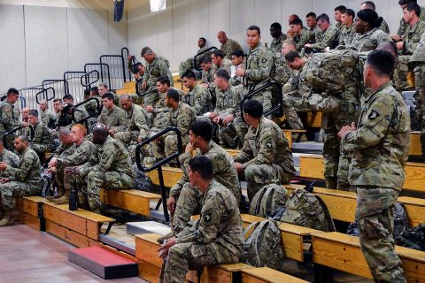 Soldiers with 2nd Brigade Combat Team, 101st Airborne Division from Fort Campbell, Kentucky, wait for transportation during their arrival for the Network Integration Exercise 17.2, here, July 5. The "Strike" Brigade with 101st ABN DIV is the first rotational brigade to conduct NIE here. (Capt. Earl Wilson) 