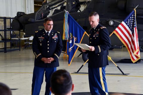 Col. Bernard Harrington, the commander of the 82nd Combat Aviation Brigade, presents an award to Chief Warrant Officer 4 James Morrow, a flight instructor from Fort Rucker, June 30, 2017 at Fort Campbell, KY. (Sgt. Marcus Floyd, 101st Combat Aviation Brigade) 