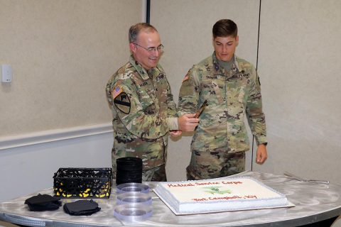 Col. Anthony L. McQueen, BACH commander, and 2nd Lt. Gregory Tarman, Jr., 626th Brigade Support Battalion, 3rd Brigade Combat Team, cut the Medical Service Corps' 100th Anniversary cake at Fort Campbell's Cole Park Commons, June 29th, as the Medical Service Corps officers at Fort Campbell gathered to celebrate the anniversary and their Corps' service in the Army.