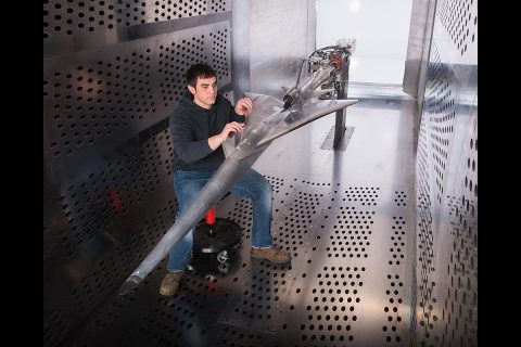 A NASA Glenn technician prepares the QueSST experimental aircraft for testing in the 8’ x 6’ wind tunnel. (NASA) A NASA Glenn technician prepares the QueSST experimental aircraft for testing in the 8’ x 6’ wind tunnel. (NASA)