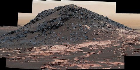 This view from the Curiosity Mars rover's Mastcam shows a dark mound, called "Ireson Hill," which rises about 16 feet above redder layered outcrop material on lower Mount Sharp, Mars, near a location where Curiosity examined a linear sand dune in February 2017. (NASA/JPL-Caltech/MSSS)