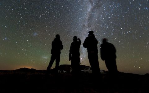 Four members of the New Horizons’ South African observation team scan the sky while waiting for the start of the 2014 MU69 occultation, early on the morning of June 3rd, 2017. (NASA/JHUAPL/SwRI/Henry Throop)