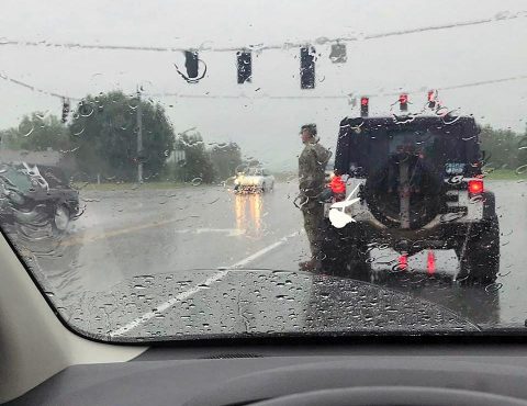 Tennessee National Guard Colonel Jack L. Usrey saluting funeral procession