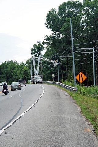 A utility relocation crew works on Warfield Boulevard, just south of Dunbar Cave Road. The utilities are being moved in advance of expansion of Warfield Boulevard to five lanes.