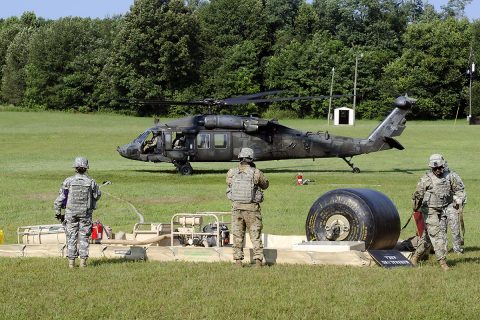 Fuelers from E Company, 6th Battalion, 101st General Support Aviation Battalion, 101st Combat Aviation Brigade, 101st Airborne Division, complete a refueling mission for a UH-60 Black Hawk helicopter Aug. 9 at Fort Campbell, Kentucky. The aviation support mission augmented the unit’s team participating in the U.S. Army Forces Command level Philip A. Connelly food service competition. (Leejay Lockhart, Fort Campbell Public Affairs Office)