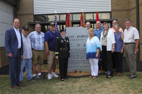 Lt. Gen. Karen Dyson, the Military Deputy to the Assistant Secretary of the Army (Financial Management and Comptroller), poses for a group picture, June 25, 2017, with veterans of the Fort Campbell finance team after the memorial rededication ceremony at the Defense Military Pay Office on Fort Campbell, Kentucky. (Sgt. Neysa Canfield/101st SBDE Public Affairs) 