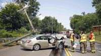 A Nissan Altima left the roadway on Crossland Avenue and stuck a utility pole Thursday afternoon. (Jim Knoll, CPD)