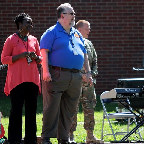 Desma Blount (left), assistant principal of Barkley Elementary School and Ted Turnipseed (right), principal of Barkley Elementary School, prepare to deliver their speeches at Barkley Elementary School. Blount and Turnipseed ad to the students and faculty in attendance at the school’s closing ceremony. The school is relocating to a new upgraded 21st century learning style building. (Sgt. Steven E. Lopez, 40th Public Affairs Detachment, 101st Airborne Division (Air Assault)) 