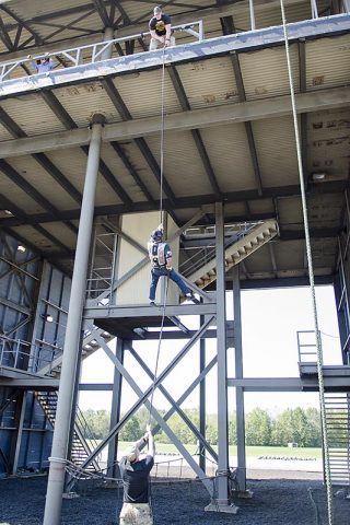 Ray Pfeffer rappels from the tower at The Sabalauski Air Assault School with help from the cadre during a tour of Fort Campbell Sept. 8, 2017. Pfeffer was part of D Company, 3rd Battalion, 187th Infantry Regiment, 3rd Brigade, 101st Airborne Division, the most highly decorated unit for its size in the Vietnam War. (Leejay Lockhart)