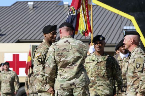 Col. Stanley J. Sliwinski, commander for the 101st Airborne Division (Air Assault) Sustainment Brigade, 101st Abn. Div., hands the brigade colors to Command Sgt. Maj. Anthony B. McAdoo, incoming command sergeant major for the 101st Abn. Div. Sust. Bde., Sept. 7, 2017, during a change of responsibility ceremony on Fort Campbell, Kentucky. (Sgt. Neysa Canfield/101st SBDE Public Affairs) 