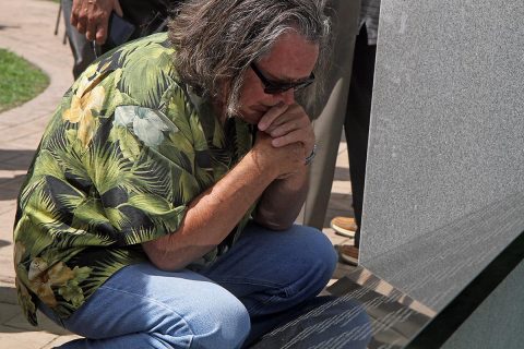 Roy Hill, a Vietnam Veteran from Rockhold, Kentucky reads names from a newly rededicated 2nd Battalion, 502nd Infantry Regiment, 101st Airborne Division Vietnam Veterans Memorial following a ceremony Fort Campbell, Ky., Wednesday, Aug. 23, 2017. Hill's unit lost more than half of its Soldiers during the war. (U.S. Army photo by Sgt. William White) 