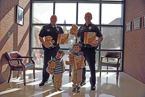 First row - Silas Brown, Henry Brown. 2nd Row - Deputy Chief Mike Parr, Lt Chad Koyama. (Jim Knoll, CPD) First row - Silas Brown, Henry Brown. 2nd Row - Deputy Chief Mike Parr, Lt Chad Koyama. (Jim Knoll, CPD)