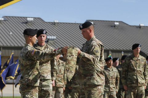 (L to R) Capt. Reyn H. Mossman, commander for 887th Engineer Support Company, attached to 716th Military Police Battalion, 101st Airborne Division (Air Assault) Sustainment Brigade, 101st Abn. Div., and 1st Sgt. Rodney B. Ammons, first sergeant for 887th ESC, uncase the company’s colors, Oct. 20, 2017, during an activation ceremony on Fort Campbell, Kentucky. (Sgt. Neysa Canfield/101st SBDE Public Affairs) 