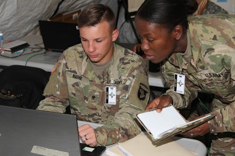 Private First Class Jordan Maine, a human resource specialist with the 101st Airborne Division Sustainment Brigade, 101st Abn. Div., works with Staff Sgt. Shenea Andrews, religious affairs noncommissioned officer in charge for the 101st Abn. Div. Sust. Bde., 101st Abn. Div., Sept. 27, during the brigade command post exercise on Fort Campbell. (101st Sustainment Brigade, 101st Airborne Division (AA) Public Affairs)