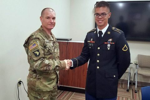 Sgt. Maj. Reeves Winters, chaplain sergeant major for the 101st Airborne Division (Air Assault), congratulates Pfc. Boaz Koski, chaplain assistant for the 101st Special Troops Battalion, 101st Airborne Division (Air Assault) Sustainment Brigade, 101st Abn. Div., after earning the title of the 101st Abn. Div. Chaplain Assistant of the Year, Sept. 20, 2017, on Fort Campbell, Kentucky. (Courtesy Photo) 