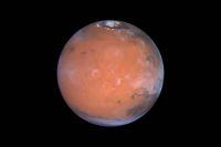 A new paper suggests hydrogen-possibly water ice-in the Medusa Fossae area of Mars, which is in an equatorial region of the planet to the lower left in this view. (Steve Lee (University of Colorado), Jim Bell (Cornell University), Mike Wolff (Space Science Institute), and NASA)