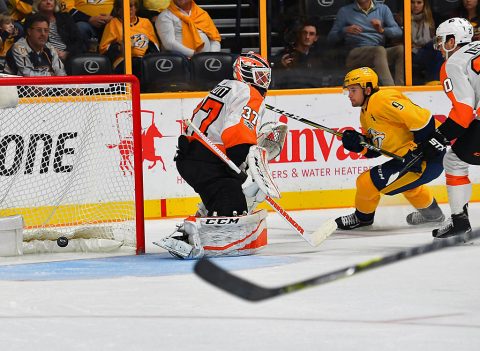 Nashville Predators left wing Filip Forsberg (9) scores past Philadelphia Flyers goalie Brian Elliott (37) during the third period at Bridgestone Arena. (Christopher Hanewinckel-USA TODAY Sports)