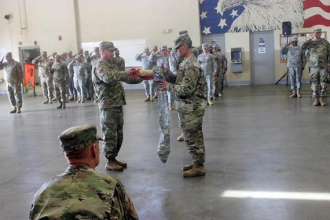 (L to R): Command Sergeant Major Michael Warren, Battalion CSM, and Lieutenant Colonel Brooke Grubb, Battalion Commander, prepare the 30th Combat Sustainment Support Battalion colors for casing prior to their deployment to Afghanistan during a ceremony on October 21, 2017 in Humboldt, Tenn. More than 30 personnel will provide logistical combat support to U.S. Forces in support of Operation Freedom’s Sentinel.