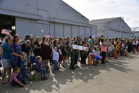 Families and friends eagerly wave to the Soldiers of the Tennessee National Guard’s 230th Signal Company, based in Nashville, Tenn., who just returned home from a year long deployment overseas Oct. 14. (Spc. Lauren Ogburn, Tennessee National Guard Joint Force Headquarters).