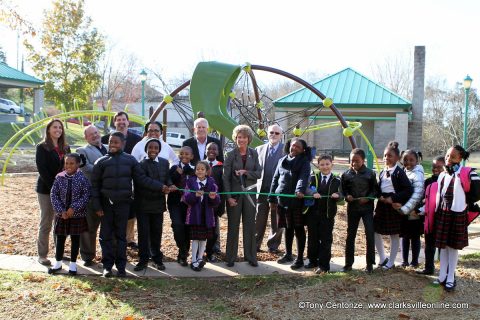 Clarksville Mayor Kim McMillan, Clarksville Parks and Recreation Director Jennifer Letourneau, members of the Clarksville City Council and students from Tabernacle Christian School cut a ribbon Monday formally reopening Valleybrook Park.