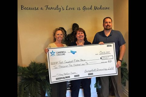 Chris Leary (far left) and John Bredehoeft (far right) with Campbell Crossing, presented a check on behalf of the Lendlease (US) Community Fund to Wendy Carlston with the Fort Campbell Fisher House.