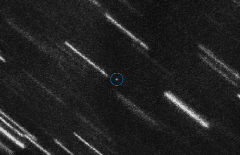 Asteroid 2012 TC4 appears as a dot at the center of this composite of 37 individual 50-second exposures obtained on Aug. 6, 2017 by the European Southern Observatory's Very Large Telescope located in the Atacama Desert region of Chile. The asteroid is marked with a circle for a better identification. The individual images have been shifted to compensate for the motion of the asteroid, so that the background stars and galaxies appear as bright trails. (NASA)