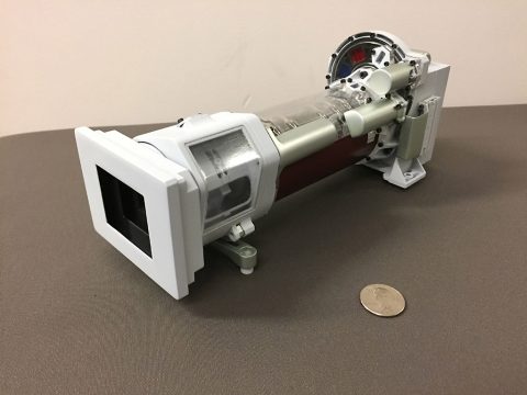 A 3-D printed model of Mastcam-Z, one of the science cameras on the Mars 2020 rover. Mastcam-Z will include a 3:1 zoom lens. A quarter is provided for scale. (NASA/JPL-Caltech)