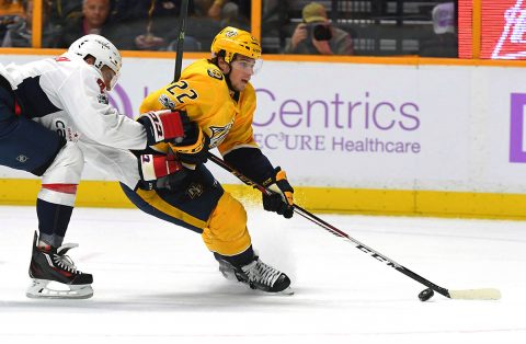 Nashville Predators left wing Kevin Fiala (22) skates past Washington Capitals defenseman Matt Niskanen (2) during the first period at Bridgestone Arena. (Christopher Hanewinckel-USA TODAY Sports)