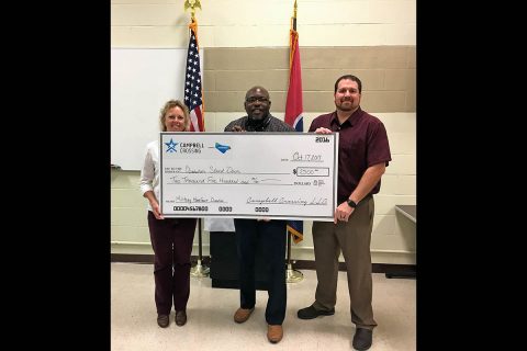 Chris Leary (far left) and John Bredehoeft (far right) with Campbell Crossing, presented a check on behalf of the Lendlease (US) Community Fund to Willie Celestine from Operation Stand Down Tennessee.