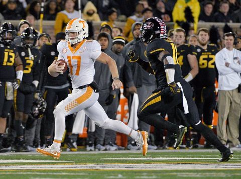 Tennessee Volunteers quarterback Will McBride (17) runs the ball as Missouri Tigers safety Jordan Ulmer (11) chases during the first half at Faurot Field. (Denny Medley-USA TODAY Sports)