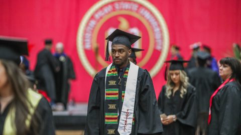 19 Austin Peay Athletes cross stage at 2017 APSU Winter Commencement ceremony. (APSU Sports Information)