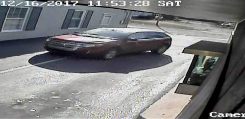 Last Friday, a woman was robbed in a parking lot on Madison Street. The suspect drove away in the red ford pictured.