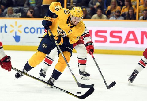 Nashville Predators defenseman Roman Josi (59) skates past Carolina Hurricanes defenders during the third period at Bridgestone Arena. (Christopher Hanewinckel-USA TODAY Sports)