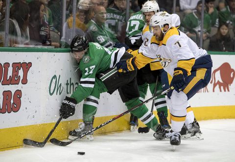 Dallas Stars center Devin Shore (17) and Nashville Predators defenseman Yannick Weber (7) fight for the puck during the second period at the American Airlines Center. (Jerome Miron-USA TODAY Sports)