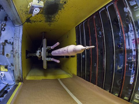 To understand the aerodynamic forces as booster separation motors fire and push the solid rocket boosters away from the rocket’s core, engineers at NASA's Langley Research Center are testing a 35-inch SLS model in Block 1B 105-metric ton evolved configuration in the Unitary Plan Wind Tunnel using a distinct pink paint. (Dave Bowman / NASA) To understand the aerodynamic forces as booster separation motors fire and push the solid rocket boosters away from the rocket’s core, engineers at NASA's Langley Research Center are testing a 35-inch SLS model in Block 1B 105-metric ton evolved configuration in the Unitary Plan Wind Tunnel using a distinct pink paint. (Dave Bowman / NASA)