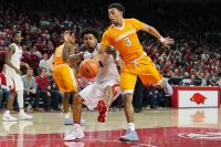 Arkansas Razorbacks guard Anton Beard (31) and Tennessee Volunteers guard James Daniel III (3) reach for a loose ball at Bud Walton Arena. Arkansas won 95-93. (Nelson Chenault-USA TODAY Sports)