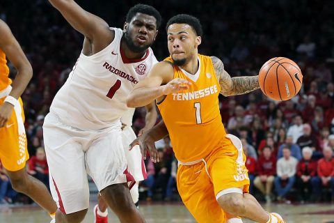 Tennessee Volunteers guard Lamonte Turner (1) dribbles around Arkansas Razorbacks forward Trey Thompson (1) at Bud Walton Arena. (Nelson Chenault-USA TODAY Sports)