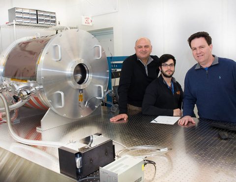 Goddard optics experts Babak Saif (left) and Lee Feinberg (right), with help from engineer Eli Griff-McMahon an employee of Genesis, have created an Ultra-Stable Thermal Vacuum system that they will use to make picometer-level measurements. (NASA/W. Hrybyk)