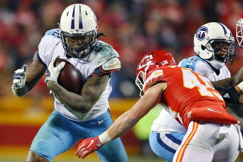 Tennessee Titans running back Derrick Henry (22) runs the ball against Kansas City Chiefs strong safety Daniel Sorensen (49) during the third quarter in the AFC Wild Card playoff football game at Arrowhead Stadium. (Jay Biggerstaff-USA TODAY Sports)