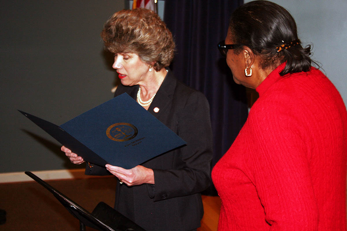 Servella Terry (right), widow of the late Rev. Jimmy Terry Sr., joined Clarksville Mayor Kim McMillan at the podium to present the Black History Month proclamation.