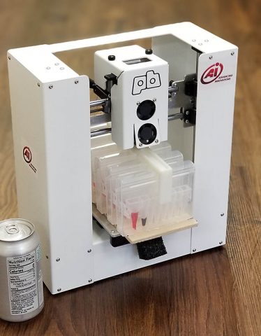 An automated DNA extractor designed by AI Biosciences. A new NASA project seeks to modify the plastic cartridge in this extractor so that it can be 3D-printed on the International Space Station. The cartridge design relies on multiple wells which a DNA sample can be dipped into; fluids in each well purifies the sample and prepares it for analysis by a MinION DNA sequencer. (AI Biosciences)