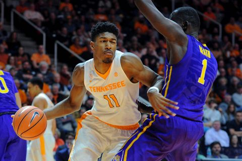Tennessee Volunteers forward Kyle Alexander (11) moves the ball defended by LSU Tigers forward Duop Reath (1) during the second half at Thompson-Boling Arena. Tennessee won 84-61. (Randy Sartin-USA TODAY Sports)
