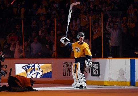 Nashville Predators goalie Pekka Rinne (35) is awarded the first star of the game after recording his 300th career win with a win over the San Jose Sharks at Bridgestone Arena. (Christopher Hanewinckel-USA TODAY Sports)